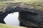 Upper Carboniferous Ross Sandstone formation eroded by wave action to leave a standing arch of sand or 